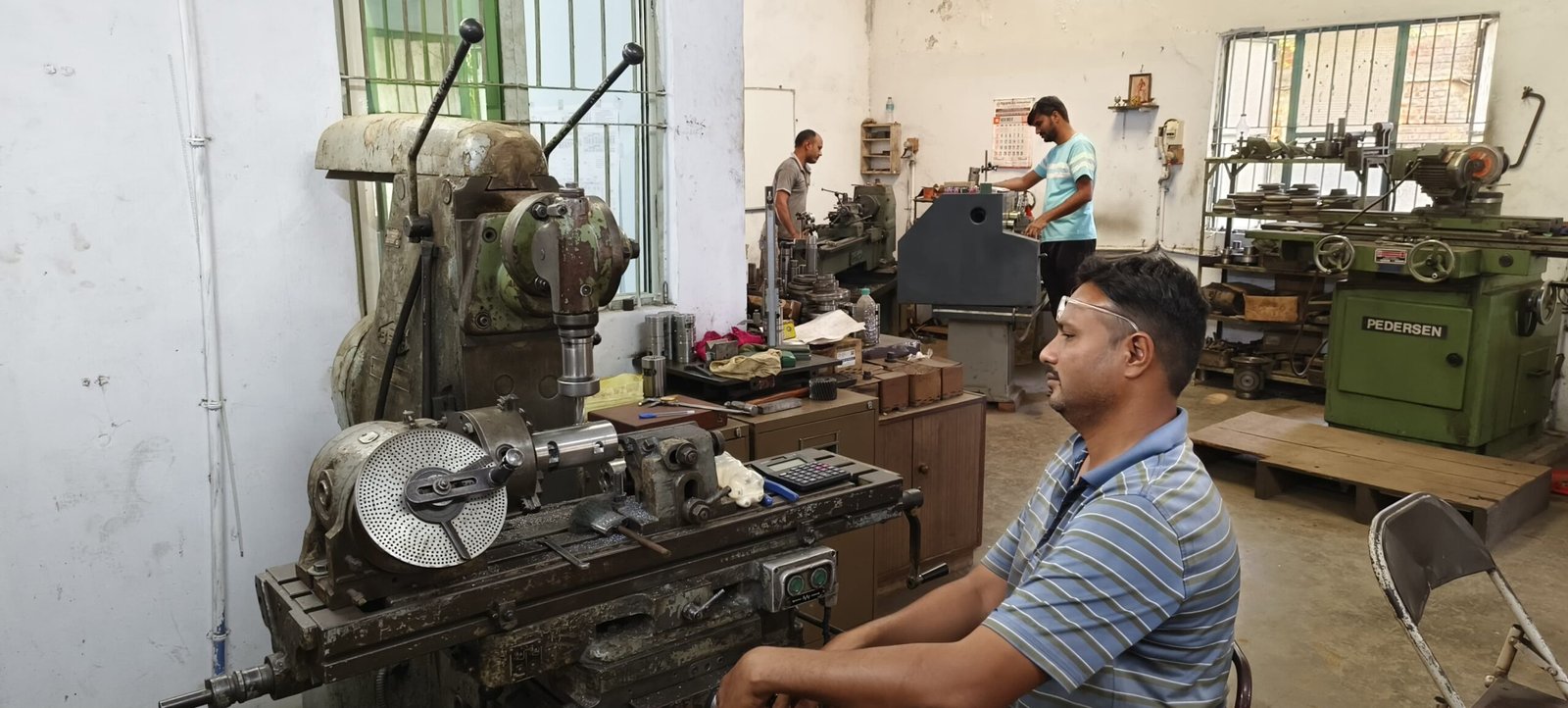UTE technician at work in the Anand workshop